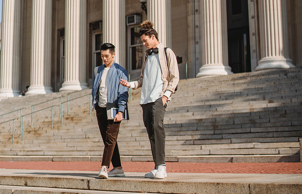 Male Students on Steps of Library